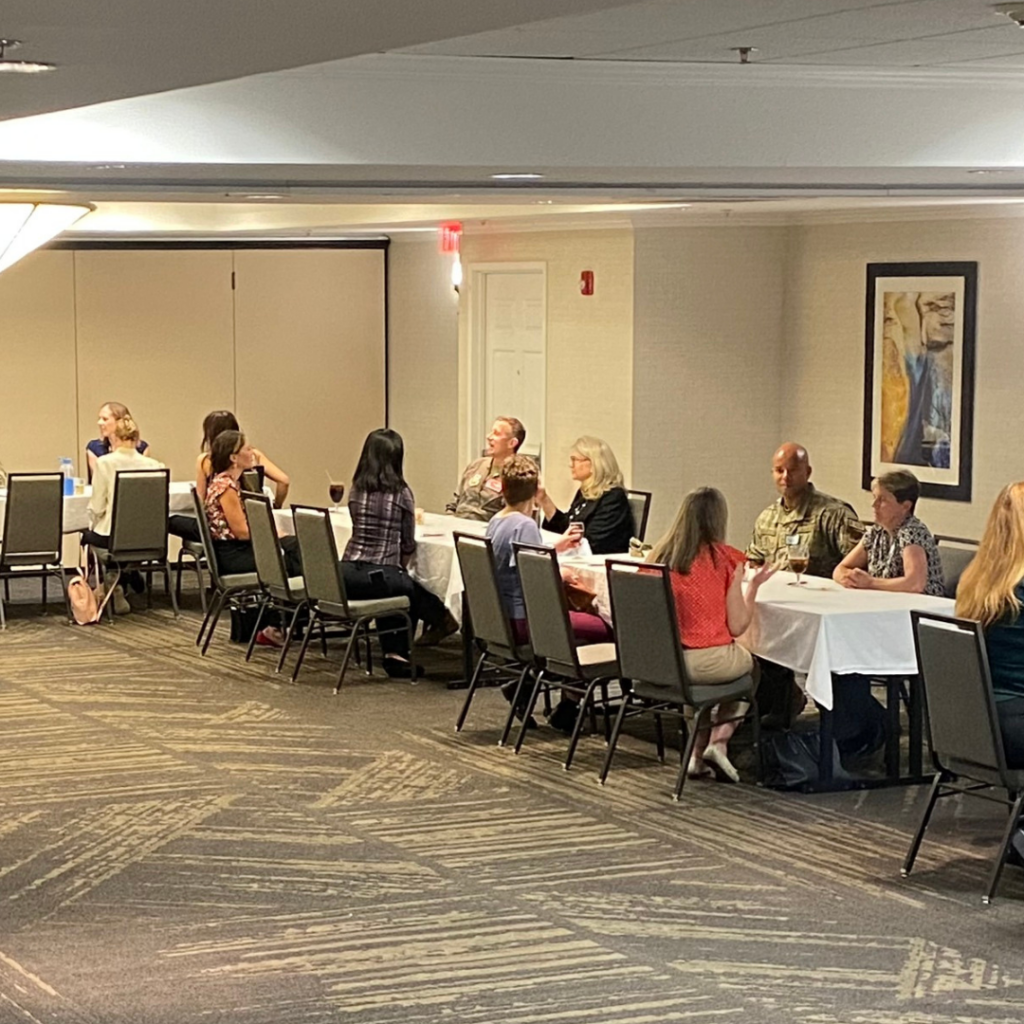 Several people talk at the WID Arizona mentoring event