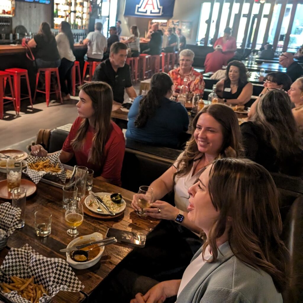 Members of the WID Arizona and NDIA team smile at a networking event