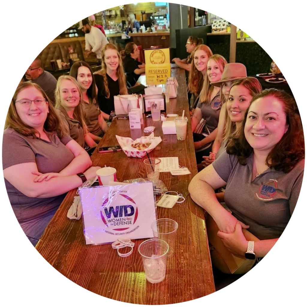 Several members of WID Arizona smile while enjoying dinner