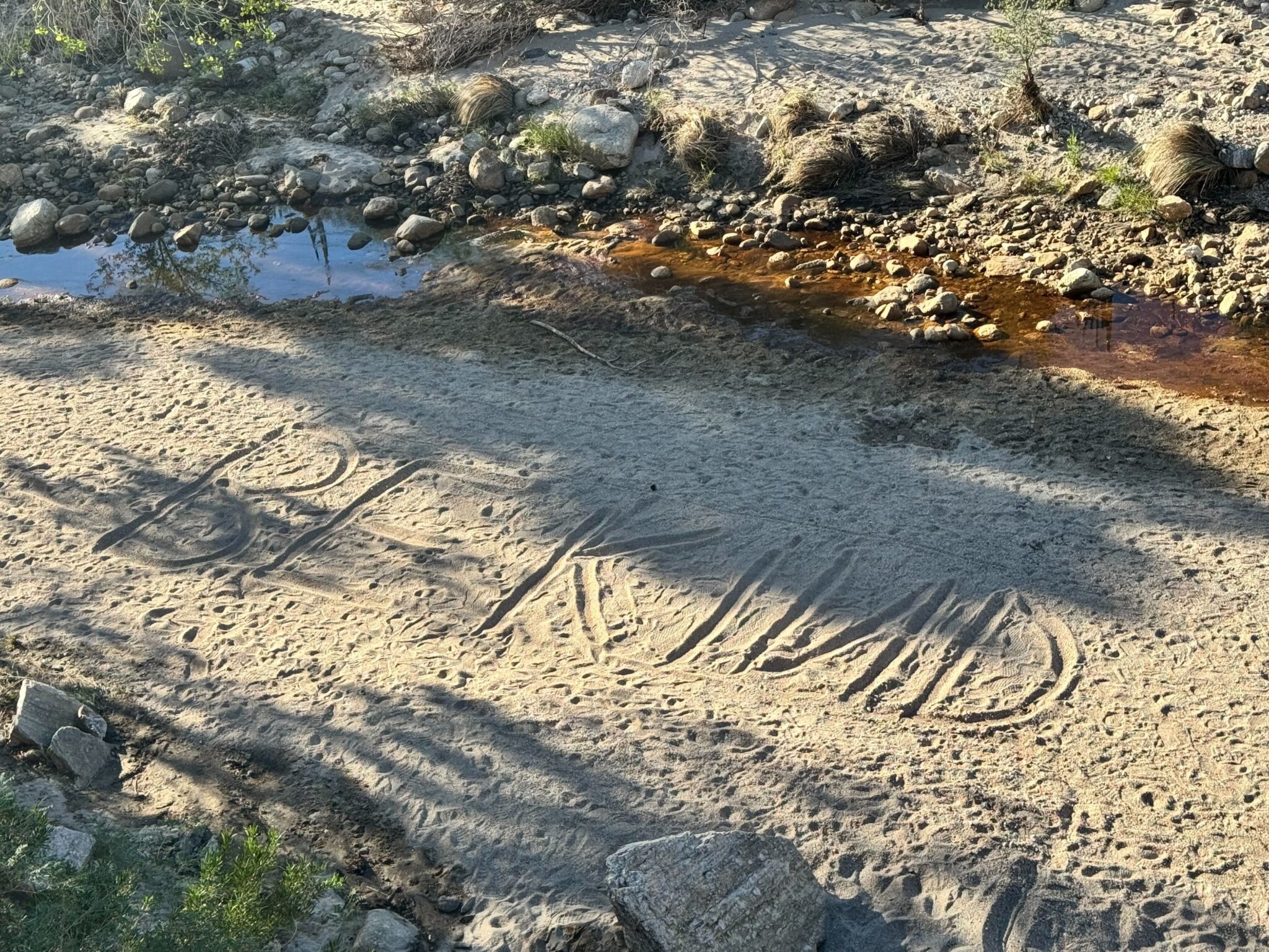 We saw a friendly reminder written deep inside the Sabino Canyon sand.